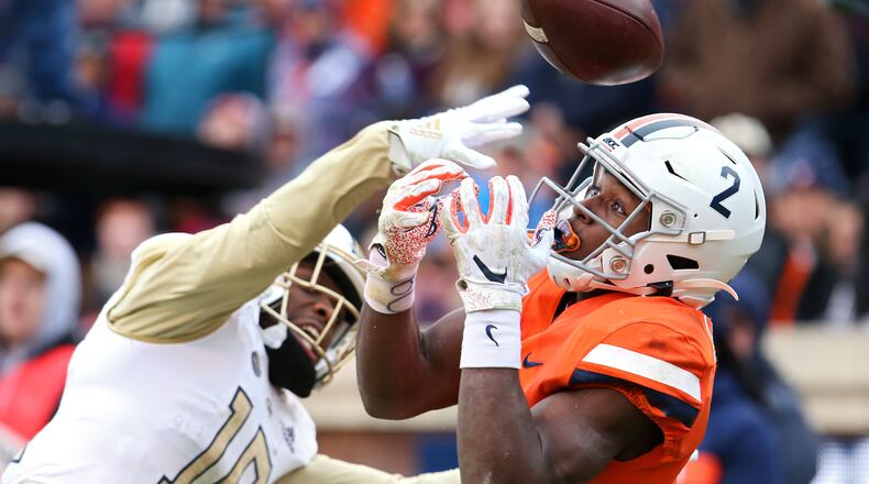 Christian Campbell (left)  of the Georgia Tech Yellow Jackets breaks up a pass intended for Joe Reed of the Virginia Cavaliers in the end zone. (Photo by Ryan M. Kelly/Getty Images)