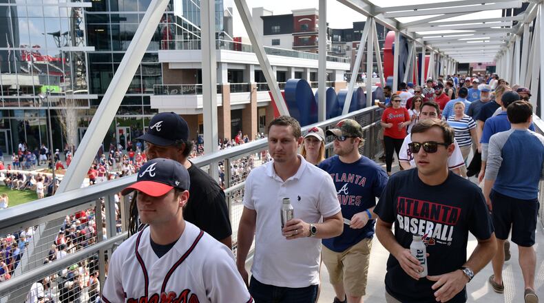 Fans enter the stadium to see the Atlanta Braves play the San Diego Padres in the season opener in the new SunTrust Park Friday.