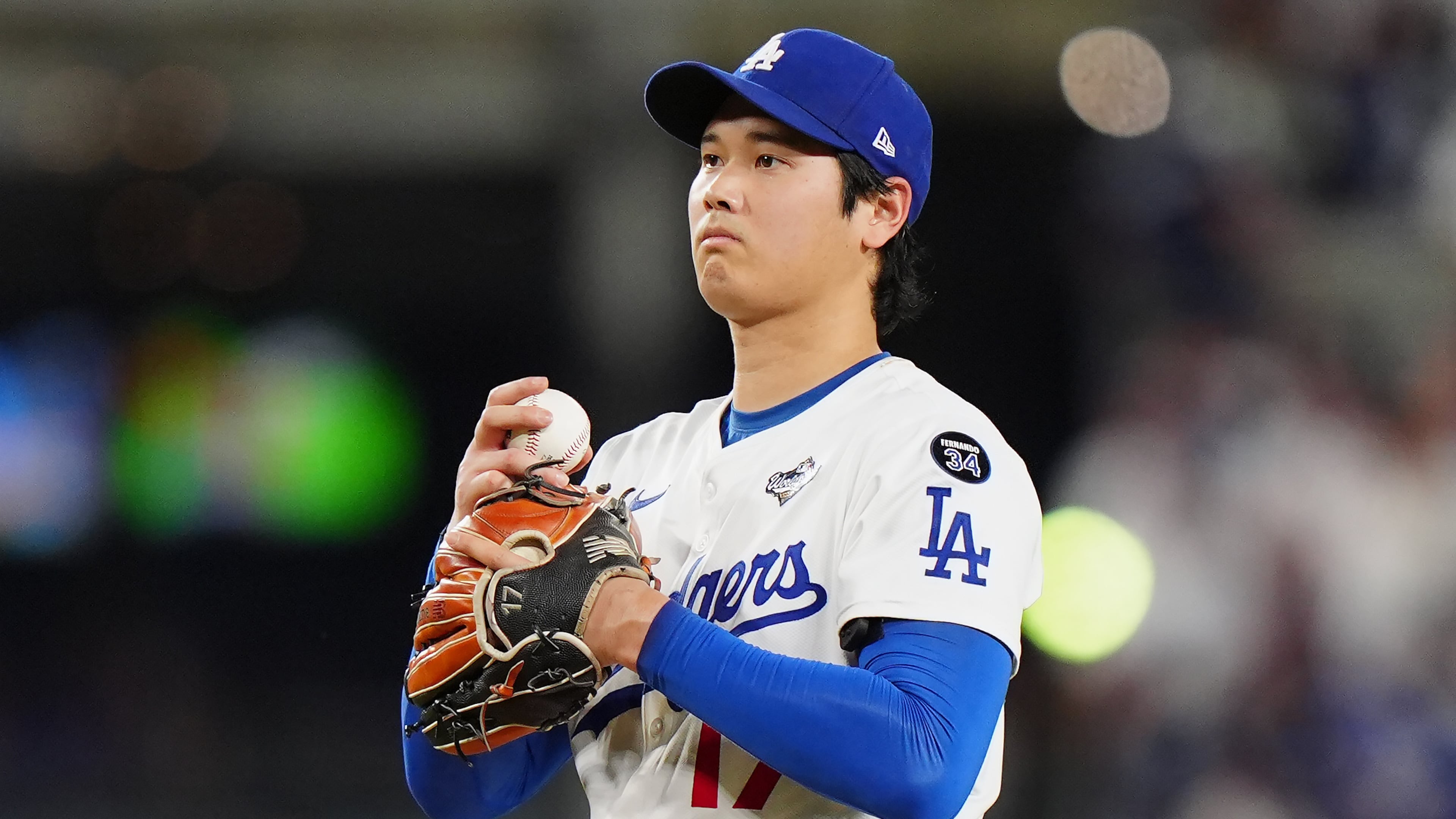 Los Angeles Dodgers pitcher Shohei Ohtani (17) reacts after giving up a double during seventh inning Game 4 World Series playoff MLB baseball action against the Toronto Blue Jays in Los Angeles on Tuesday, Oct. 28, 2025. (Frank Gunn/The Canadian Press via AP)