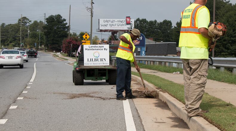 Lilburn CID workers performing landscape maintenance along Lawrenceville Highway. Courtesy Lilburn CID