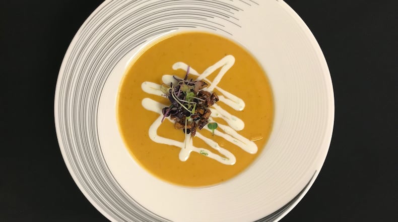 Sweet potato curry, lime cream, spiced pecans, micro greens on the menu at The Whiskey Project