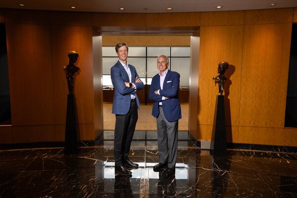 (L-R) Ben Jarrard, a new senior policy director at Dentons and former chief of staff to the Georgia Senate majority leader, and Eric Tanenblatt, Dentons’ global chair of public policy and regulation, pose for a portrait at the law firm’s office in Atlanta on July 29, 2026. (Arvin Temkar/AJC)