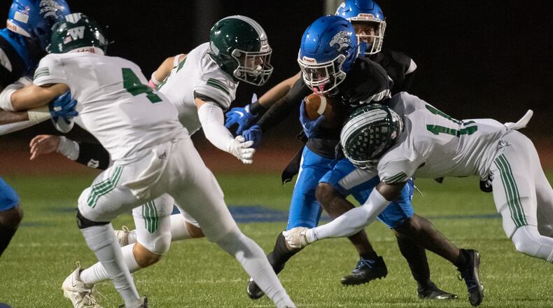 Stephenson's Devin Ingram runs for yardage against Westminster. Ingram finished with 191 yards on the ground and Stephenson won 18-13 at James Hallford Stadium, Friday night, October 7, 2022 (Photo Jamie Spaar for The Atlanta Journal-Constitution)