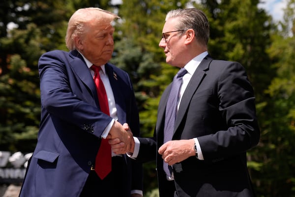 President Donald Trump meets with Britain's Prime Minister Keir Starmer on the sidelines of the G7 Summit, Monday, June 16, 2025, in Kananaskis, Canada. (AP Photo/Mark Schiefelbein)