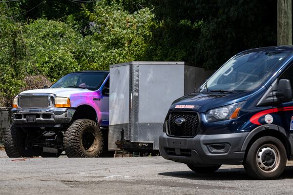 Two kidnapped children were recovered from inside a tow trailer on the property of the Gateway South apartment complex on Monday, Aug. 17, 2026.  (Ben Hendren for the AJC)