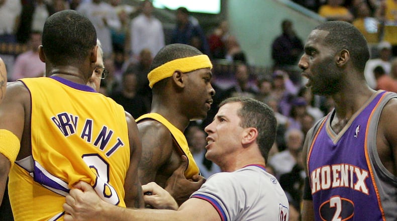 NBA official Tim Donaghy separates Phoenix Suns and Los Angeles Lakers players during the second half of the Lakers' 99-92 victory in an NBA basketball first-round playoff game in this April 28, 2006 file photo, in Los Angeles. Jeff Lewis/AP