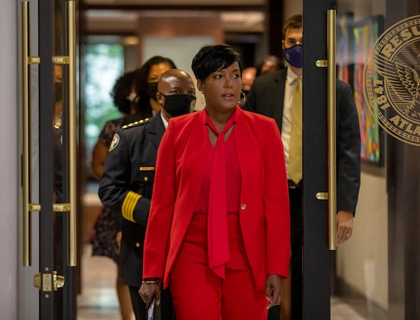 Atlanta Mayor Keisha Lance Bottoms is followed by Atlanta Police Chief Rodney Bryant as they make their way to a press conference about the Atlanta Anti-Violence Advisory Council at Atlanta City Hall, Friday, July 16, 2021. (Alyssa Pointer/AJC)