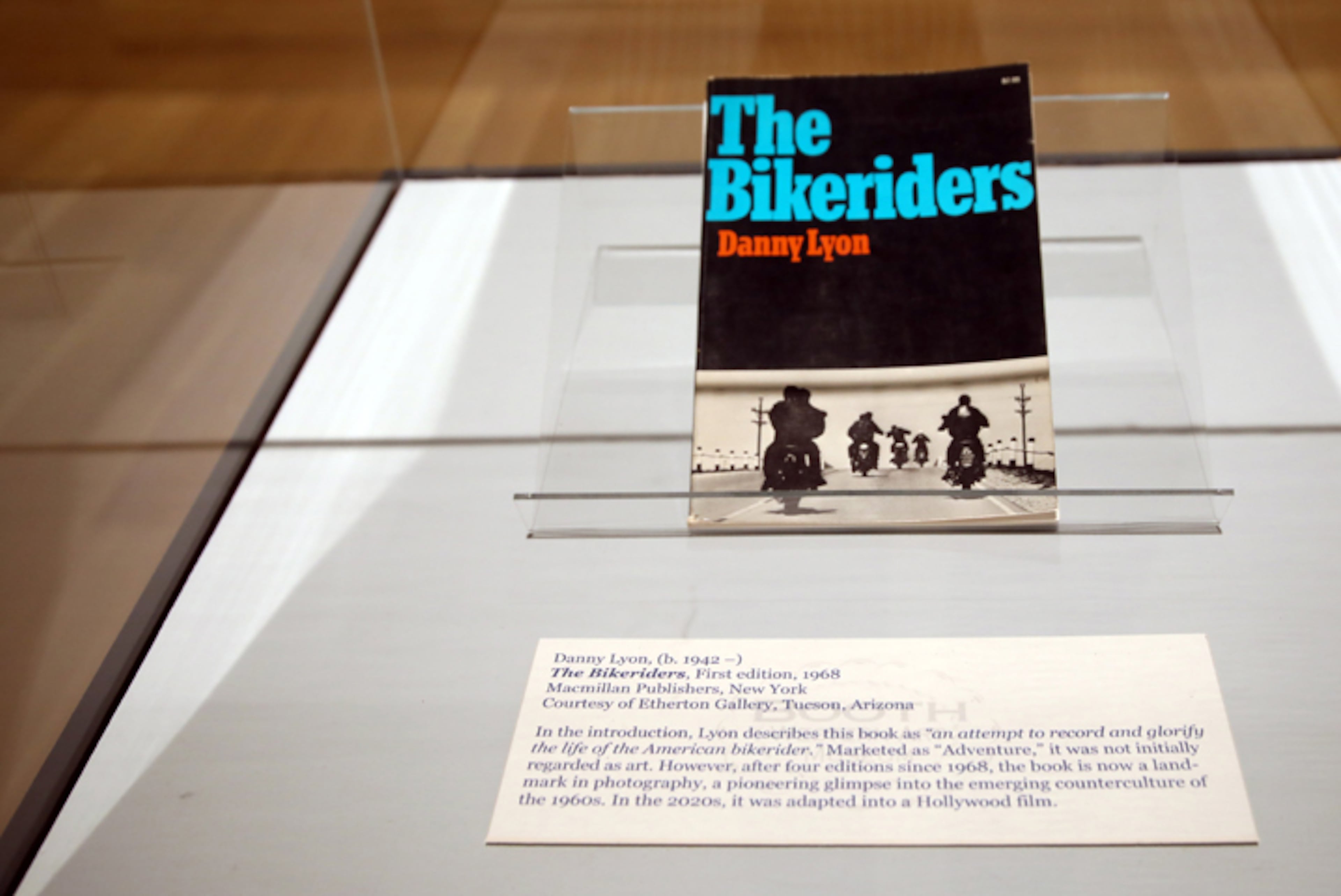 A copy of Danny Lyon's “The Bikeriders,” initially published in 1968, is under glass at the Cartersville museum. (courtesy of Booth Western Art Museum)
