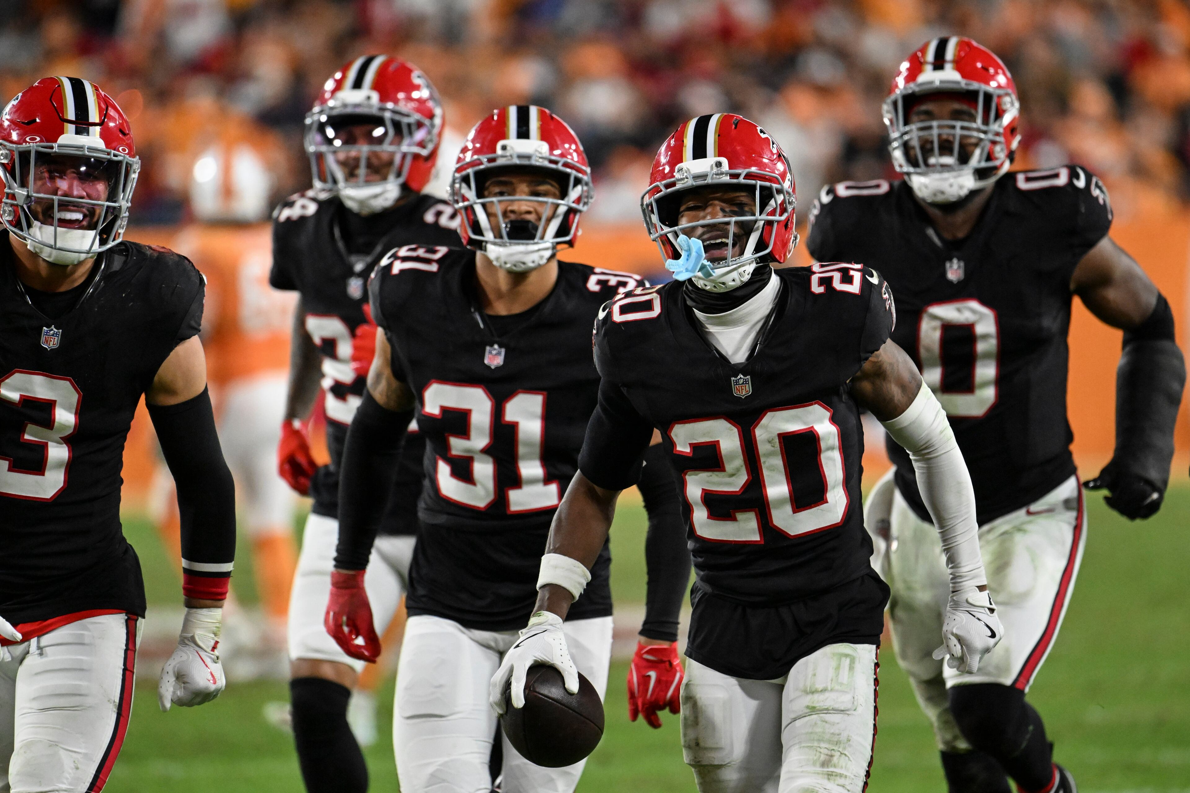Atlanta Falcons cornerback Dee Alford (20) celebrates his interception against the Tampa Bay Buccaneers during the second half of an NFL football game, Thursday, Dec. 11, 2025, in Tampa, Fla. (AP Photo/Jason Behnken)