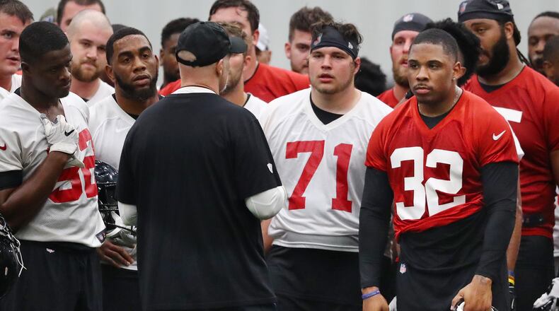 Falcons running back Qadree Ollison (far right) listens as head coach Dan Quinn coaches up his rookie class during the second day of rookie minicamp on Saturday, May 11, 2019, in Flowery Branch.  Curtis Compton/ccompton@ajc.com