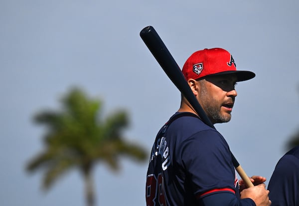 Braves third base coach Matt Tuiasosopo talks to other coaches during spring training baseball workouts at CoolToday Park, Thursday, February, 15, 2024, in North Port, Florida. (Hyosub Shin / Hyosub.Shin@ajc.com)