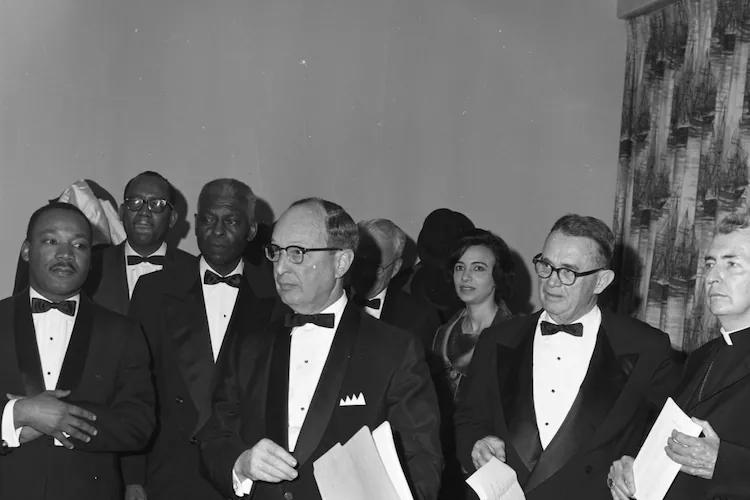 From left, the Rev. Martin Luther King Jr., Morehouse College President Benjamin E. Mays, Rabbi Jacob Rothschild, Atlanta Constitution editor Ralph McGill (in glasses) and Catholic Archbishop Paul Hallinan attend the Nobel Peace Prize recognition dinner honoring King in Atlanta on Jan. 27, 1965. (Credit: LBSCB12-120g, Lane Brothers Commercial Photographers Photographic Collection, 1920-1976. Special Collections and Archives, Georgia State University Library)
