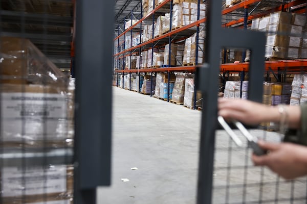 Boxes of election records, including from 2020, appear in a locked cage at the Fulton County Clerk’s Warehouse, which is behind the Fulton County Election Hub and Operation Center, in Union City on Friday, March 20, 2026. Some 2020 election records were not seized by the FBI in their raid in late January. (Arvin Temkar/AJC)