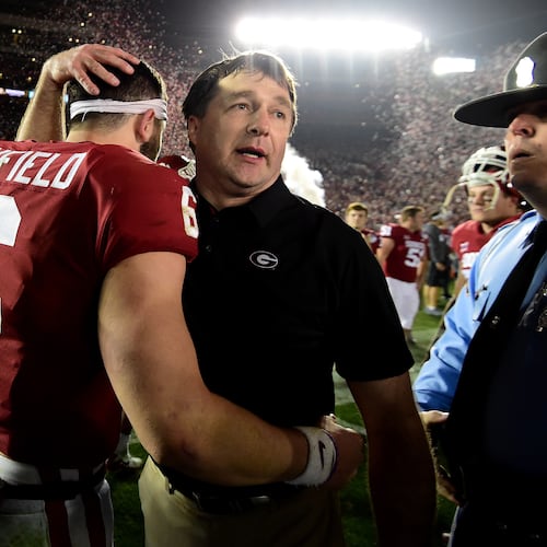 Head Coach Kirby Smart of the Georgia Bulldogs hugs quarterback Baker Mayfield of the Oklahoma Sooners after the Bulldogs beat the Oklahoma Sooners 54-48 in double overtime in the 2018 College Football Playoff Semifinal Game at the Rose Bowl Game presented by Northwestern Mutual at the Rose Bowl on Jan. 1, 2018, in Pasadena, California. (Courtesy of Harry How)