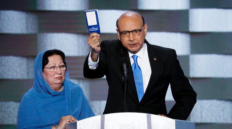 Khizr Khan, father of fallen U.S. Army Capt. Humayun S. M. Khan, speaks as his wife Ghazala listens during the final day of the Democratic National Convention in Philadelphia in 2016. AP/J. Scott Applewhite
