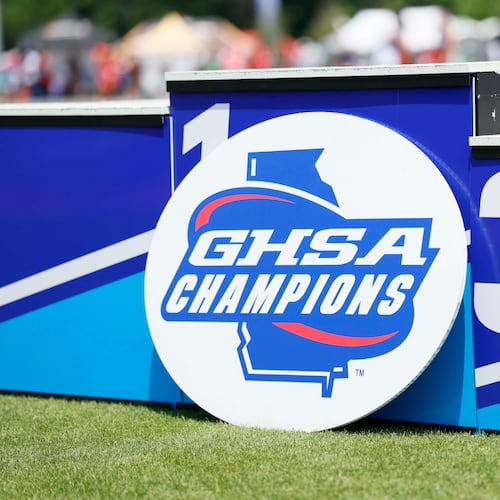 A GHSA logo is seen on the athletes’ podium during the Boys 1600-meter Run 1A Division 2 at the GHSA track and field state championships at UGA Spec Towns Track on Monday, May 11, 2026, in Athens. (Miguel Martinez/AJC)