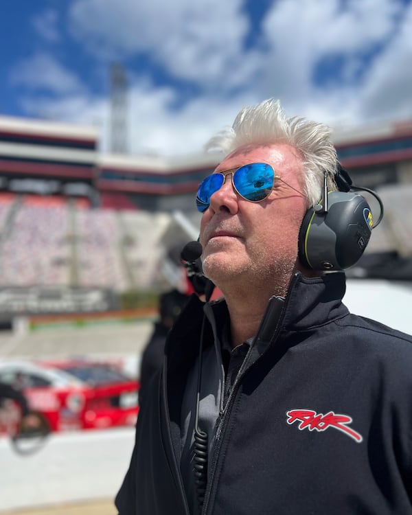 In this image provided by TrueSpeed Communication, NASCAR team owner Rick Ware watches on-track action at Bristol Motor Speedway, April 13, 2025, in Bristol, Tenn. (Mike Arning/TrueSpeed Communication via AP )