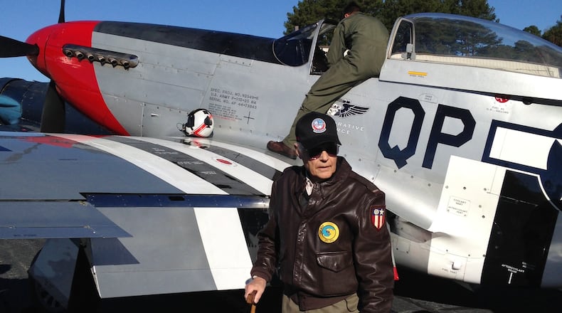 On Tuesday, Dec. 15, Paul Crawford, 91, a fighter pilot during World War II, enjoyed a few barrel rolls in a restored P-51 Mustang — the same sort of plane he flew over China. It was the first time he’d been aloft in a Mustang since 1945. The plane is owned by the Dixie Wing of the Commemorative Air Force, based out of Peachtree City’s Falcon Field, and his pilot was Al Armstrong. Photo courtesy Steve Forsyth