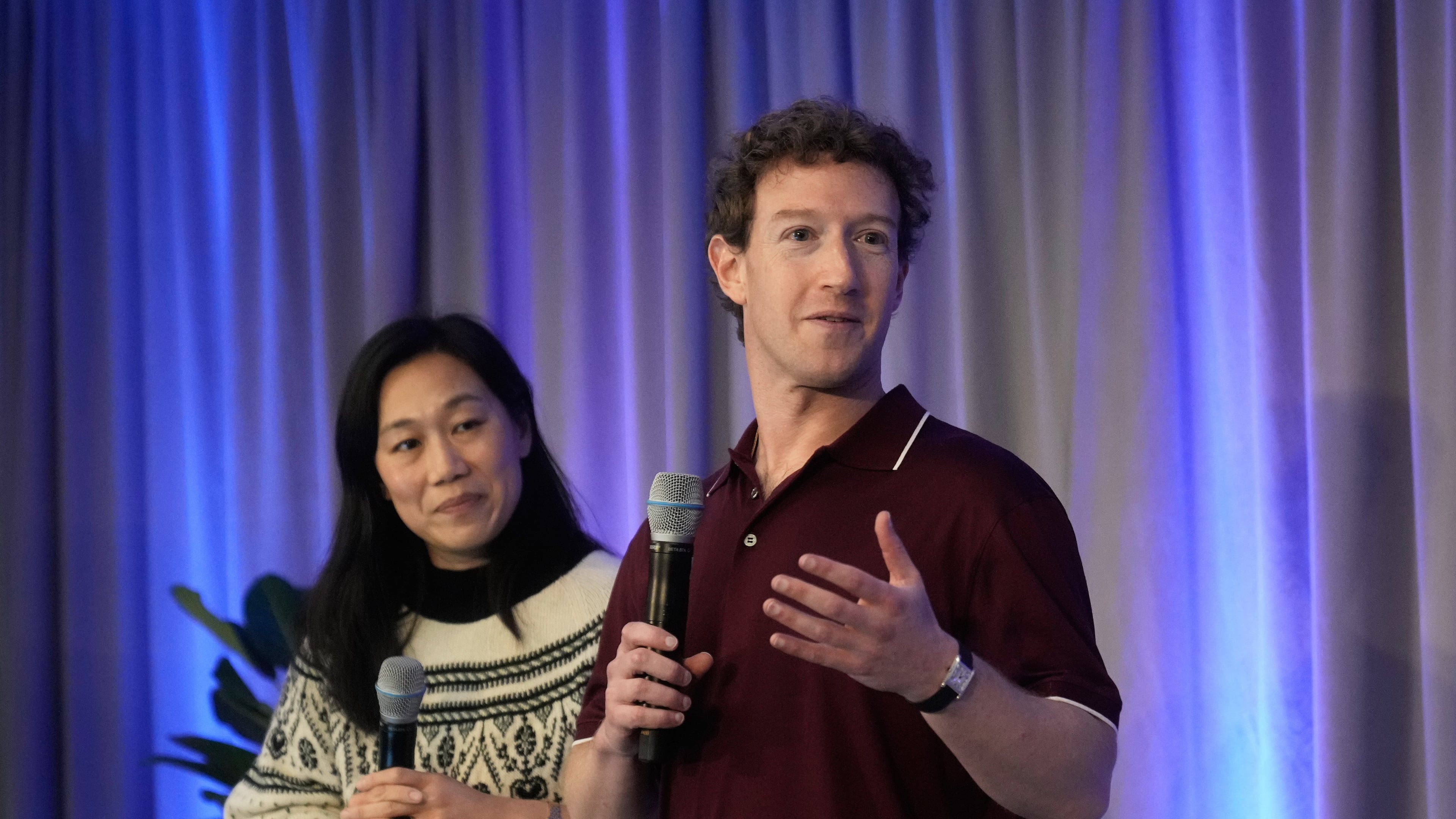 Meta CEO Mark Zuckerberg, right, speaks next to his wife, Priscilla Chan, co-founder and co-CEO of the Chan Zuckerberg Initiative (CZI), during an event at the Biohub Imaging Institute in Redwood City, Calif., Wednesday, Nov. 5, 2025. (AP Photo/Jeff Chiu)