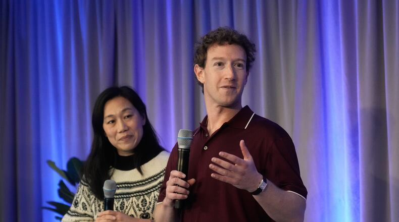 Meta CEO Mark Zuckerberg, right, speaks next to his wife, Priscilla Chan, co-founder and co-CEO of the Chan Zuckerberg Initiative (CZI), during an event at the Biohub Imaging Institute in Redwood City, Calif., Wednesday, Nov. 5, 2025. (AP Photo/Jeff Chiu)