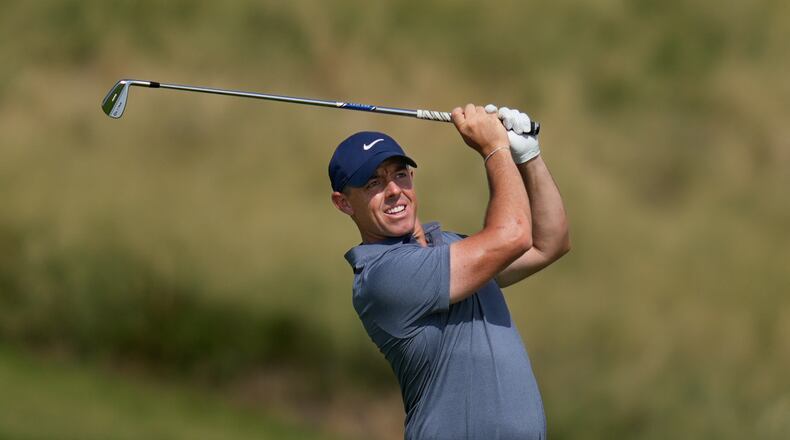 Rory McIlroy of Northern Ireland watches after playing second shot on the 7th hole during the final round of Abu Dhabi Golf Championship in Abu Dhabi, United Arab Emirates, Sunday, Nov. 9, 2025. (AP Photo/Altaf Qadri)