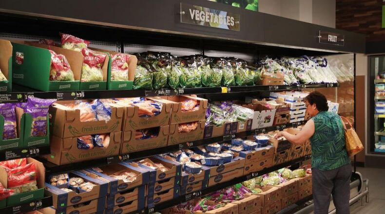 A customer shops at an Aldi grocery store.