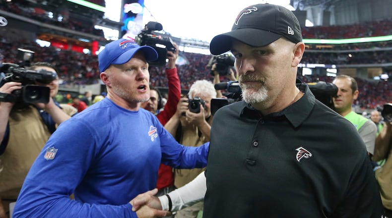 Buffalo Bills head coach Sean McDermott speaks with Atlanta Falcons head coach Dan Quinn after an NFL football game, Sunday, Oct. 1, 2017, in Atlanta. The Buffalo Bills won 23-17. (AP Photo/John Bazemore)