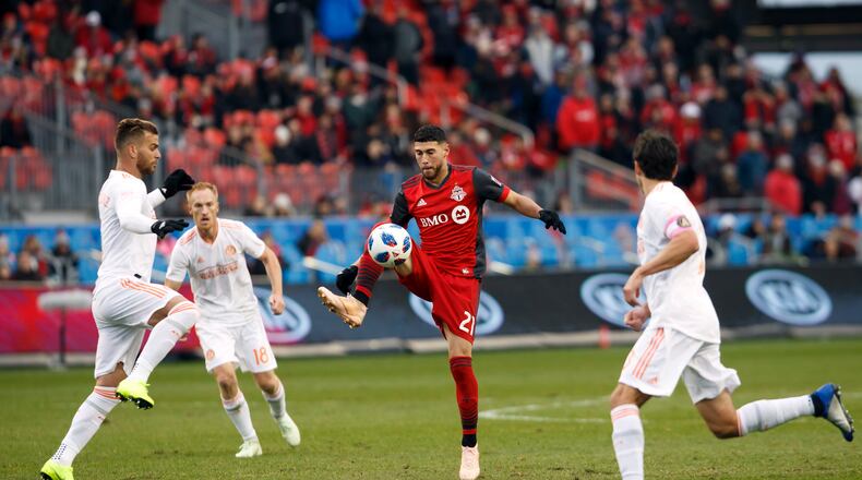 Toronto FC midfielder Jonathan Osorio (21) controls the ball against Atlanta United during the first half of MLS soccer game action in Toronto, Sunday, Oct. 28, 2018. (Cole Burston/The Canadian Press via AP)