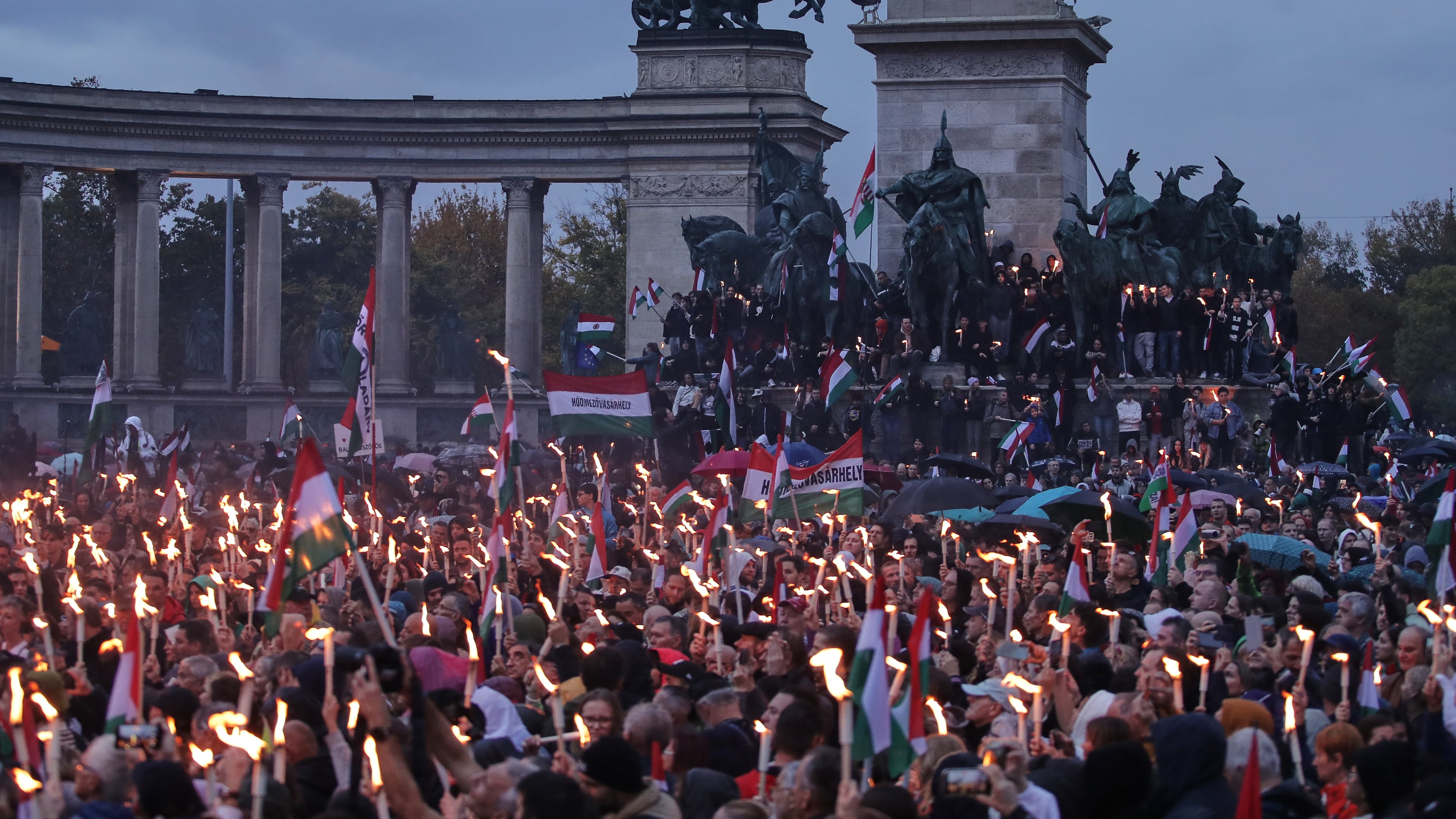 Demonstrators take part in a rally organized by the opposition TISZA party during celebrations marking the 69th anniversary of the outbreak of Hungary's 1956 revolution against communist rule and the Soviet Union, in Budapest, Hungary, Thursday, Oct. 23, 2025. (AP Photo/Rudolf Karancsi)