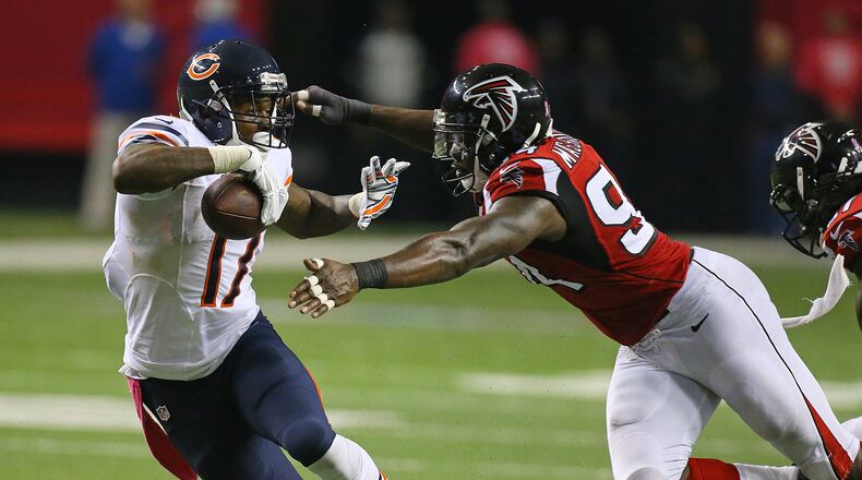 Bears wide receiver Alshon Jeffery makes a first down reception past Falcons Jonathan Massaquoi during the second half in their football game on Sunday, Oct. 12, 2014, in Atlanta.