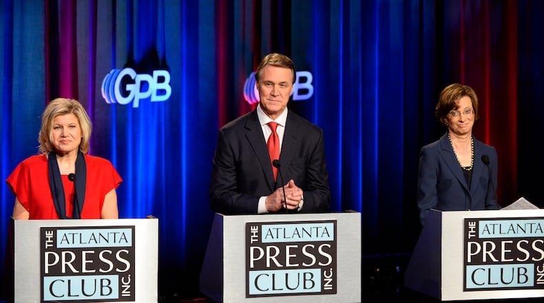 Georgia U.S. Senatorial candidates including Libertarian Amanda Swafford, Republican David Perdue and Democrat Michelle Nunn, from left to right, conclude their debate sponsored by the Atlanta Press Club at the Georgia Public Broadcasting studios Sunday, Oct. 26, 2014, in Atlanta. David Tulis / AJC Special Georgia U.S. Senatorial candidates -- from left to right, Libertarian Amanda Swafford, Republican David Perdue and Democrat Michelle Nunn – at a Sunday debate sponsored by the Atlanta Press Club at the Georgia Public Broadcasting studios. David Tulis / AJC Special