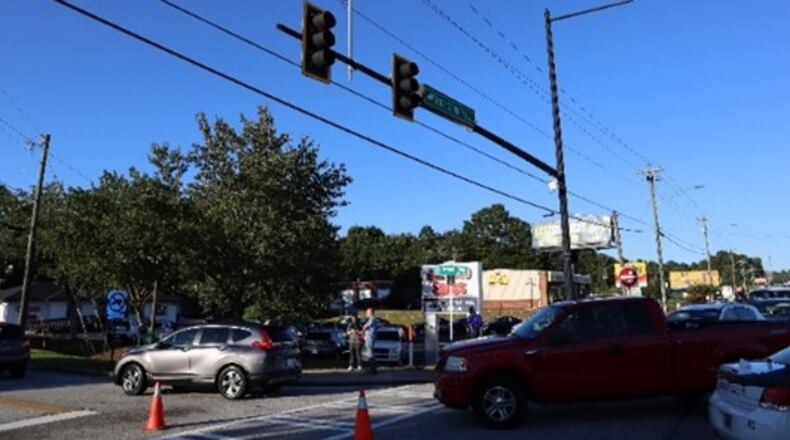Gwinnett County police say the driver of the SUV stopped and got out of his car, approached the scene, then returned to the car and fled.