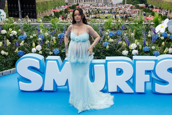 Rihanna poses for photographers upon arrival at the world premiere of the film "Smurfs", on Saturday, June 28, 2025, in Brussels. (AP Photo/Omar Havana).