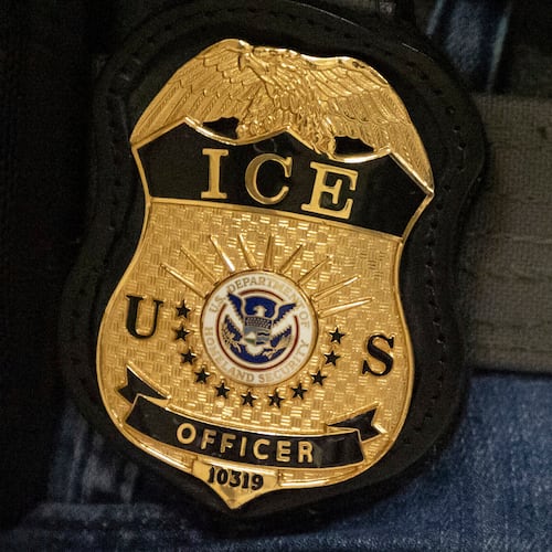 FILE - A federal agent wears an Immigration and Customs Enforcement badge in New York, June 10, 2025. (AP Photo/Yuki Iwamura, File)