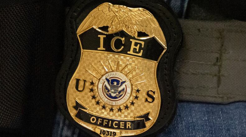 FILE - A federal agent wears an Immigration and Customs Enforcement badge in New York, June 10, 2025. (AP Photo/Yuki Iwamura, File)