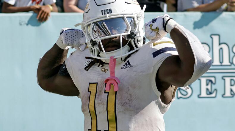 Georgia Tech running back Jamal Haynes (11) celebrates after he scored the winning touchdown on a long run in the closing seconds of an NCAA college football game against North Carolina, Saturday, Oct. 12, 2024, in Chapel Hill, N.C. (AP Photo/Chris Seward)