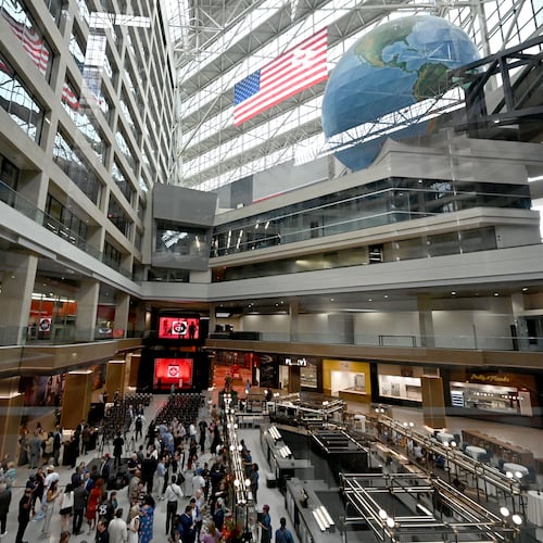 Guests mingle ahead of an unveiling event at The CTR, the former CNN Center, on Wednesday, May 20, 2026, in Atlanta. The former CNN Center in downtown Atlanta has been rebranded and unveiled as The CTR (stylized as "The Center"). CP Group, the property's owners, are transforming the iconic 1.2-million-square-foot complex into a massive mixed-use hub featuring a revamped food hall, experiential entertainment, and public art. (Hyosub Shin/AJC)