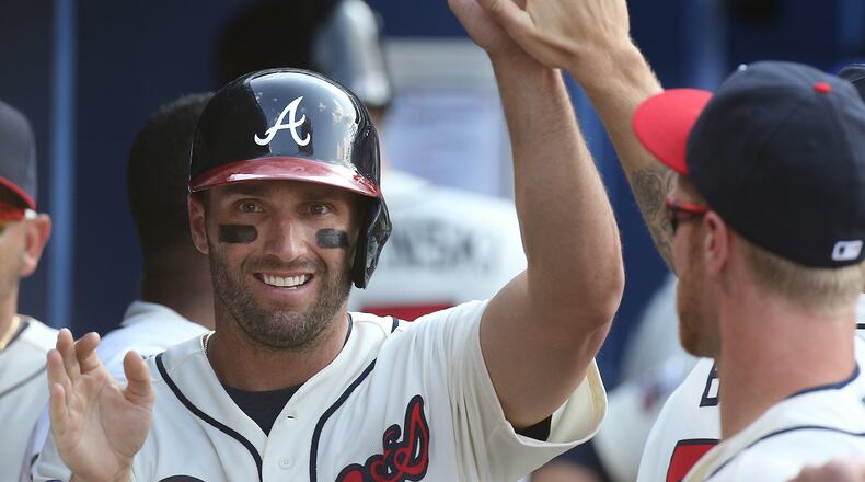 Jeff Francoeur accepts congratulations after scoring fro the Braves last May. (Curtis Compton / ccompton@ajc.com)