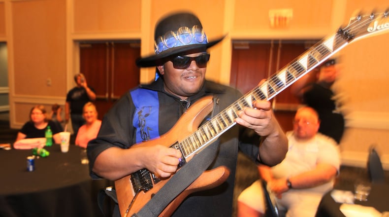 Zayne Harshaw, founder of Blue Spectrum, performs at the ARC of Ohio People First dance on July 12, 2019, at the Nationwide Hotel and Conference Center in Lewis Center, Ohio. (Doral Chenoweth III/Columbus Dispatch/TNS)