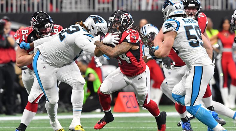 Atlanta Falcons running back Devonta Freeman (24) breaks away for a first down during the first half in a NFL football game at Mercedes-Benz Stadium on Sunday, December 8, 2019. (Hyosub Shin / Hyosub.Shin@ajc.com)