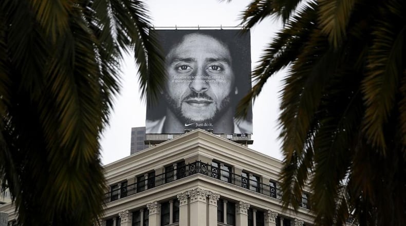 A billboard featuring former San Francisco 49ers quaterback Colin Kaepernick is displayed on the roof of the Nike Store in San Francisco.
