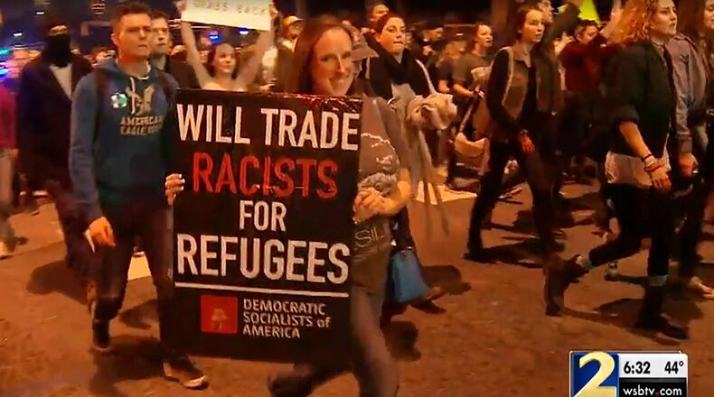 Anti-Trump protesters march through downtown Atlanta on Wednesday night, November 9, 2016 (Credit : Channel 2 Action News / WSB-TV)