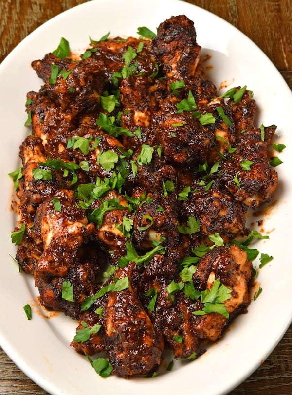 Chile Coffee Sticky Wings, by Adriana Frazier, director of operations and innovation of Suwanee-based Volcanica Coffee, are bursting with flavors — sweet and savory, but also spicy. (Styling by Adriana Frazier / Chris Hunt for the AJC)