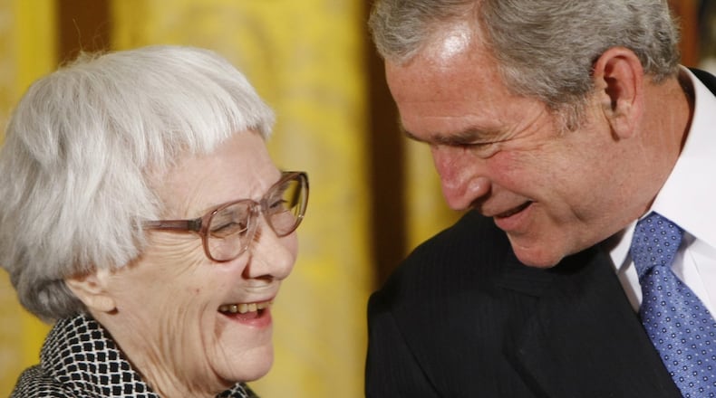 Harper Lee, who died last year, surprised the literary world by publishing her second novel, “Go Set a Watchman,” more than 50 years after her debut, “To Kill Mockingbird.” Here she is seen in 2007, receiving the Presidential Medal of Freedom from President George W. Bush. CONTRIBUTED BY ERIC DRAPER