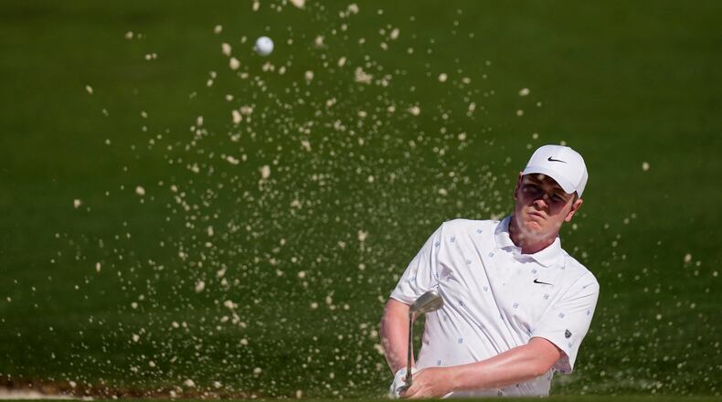 Robert MacIntyre, of Scotland, hits from the bunker on the second hole during the second round of the Masters golf tournament at the Augusta National Golf Club, Friday, April 10, 2026, in Augusta, Ga. (AP Photo/David J. Phillip)
