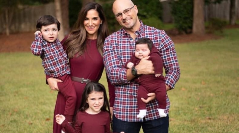 Dr. Enrique Lopez, in this photo at right, with his family. Lopez works in the intensive care unit at Phoebe Putney Memorial Hospital in Albany, Georgia. The hospital is in the midst of the outbreak of COVID-19, the disease caused by the novel coronavirus. Lopez runs one of the intensive care units, trying to keep uninfected patients safe from the virus. (PHOTO courtesy of Dr. Enrique Lopez)