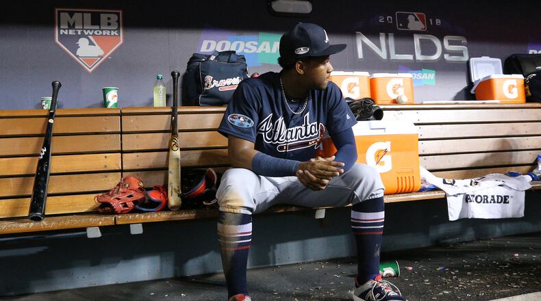 Braves’ Ronald Acuna Jr. sits in the dugout during the 9th inning of a 6-0 shutout loss to the Los Angeles Dodgers. Curtis Compton/ccompton@ajc.com