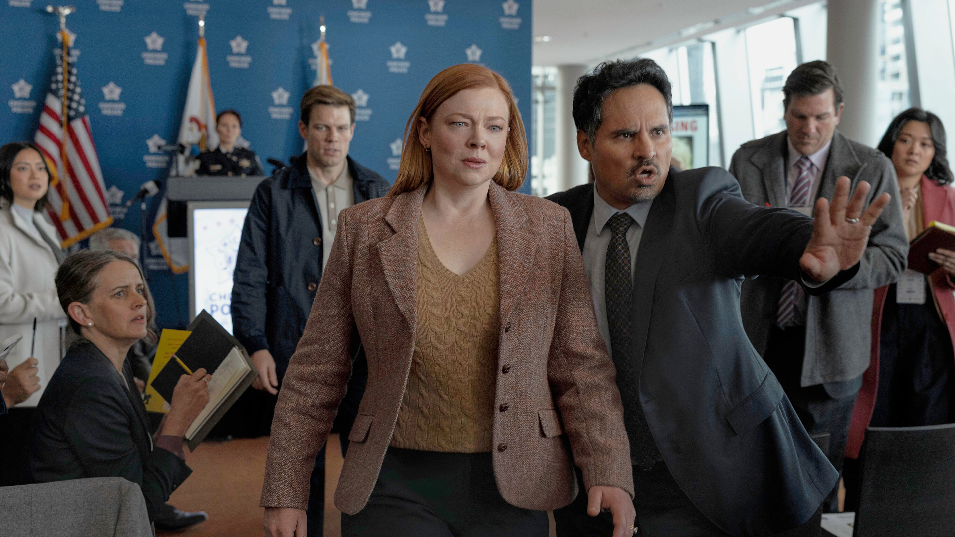 This image released by Peacock shows Sarah Snook, center, and Michael Peña, right, in a scene from "All Her Fault." (Sarah Enticknap/Peacock via AP)
