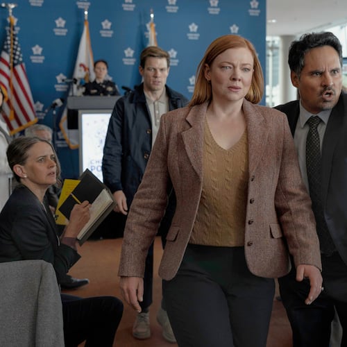 This image released by Peacock shows Sarah Snook, center, and Michael Peña, right, in a scene from "All Her Fault." (Sarah Enticknap/Peacock via AP)