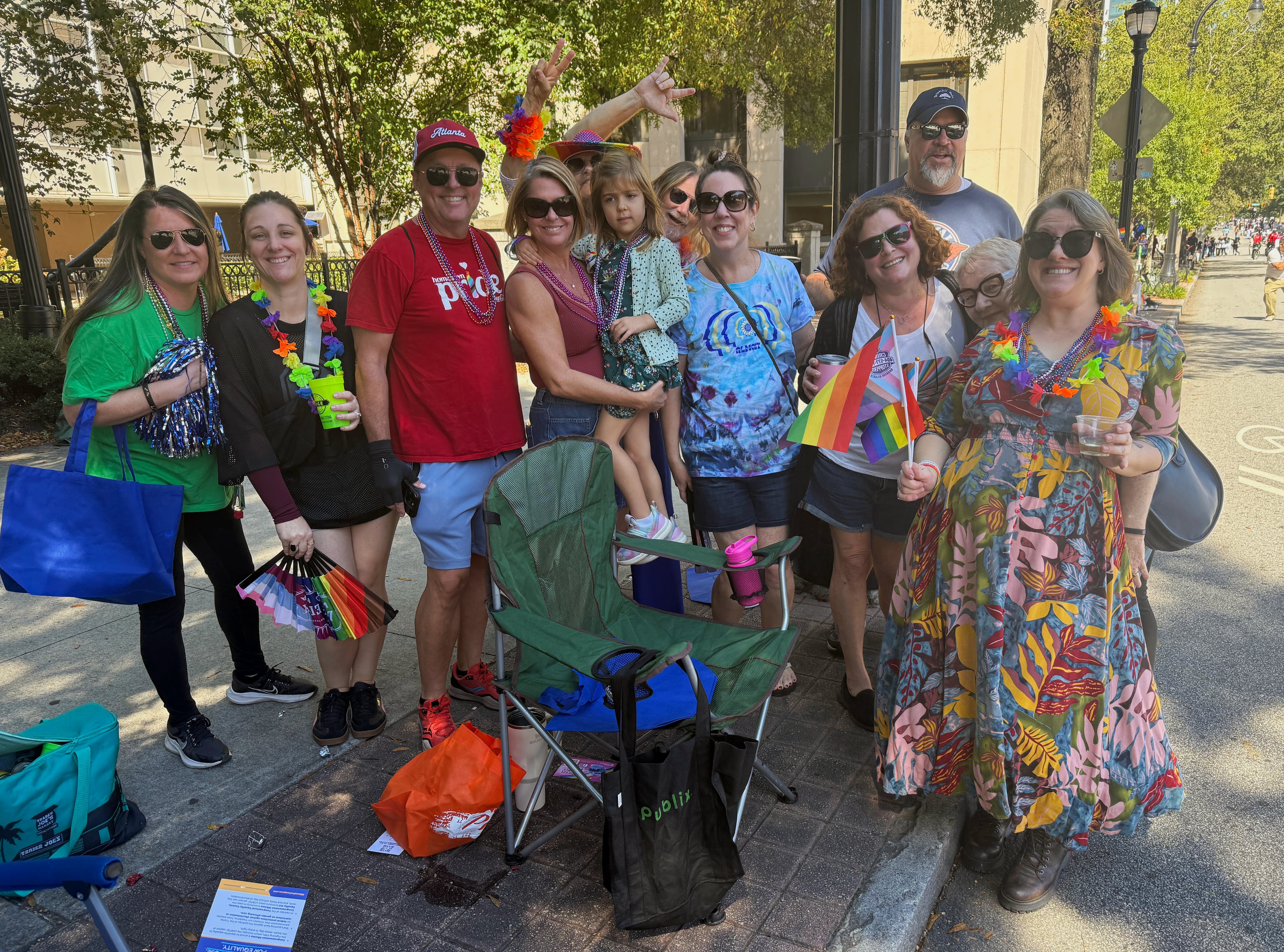 A group dubbed the Renaissance Park Team has been coming to Atlanta's Pride Parade together for 13 years. The group formed via a mutual friend and neighbor and is a group of both straight and LGBTQ+ friends. (Danielle Charbonneau/AJC)